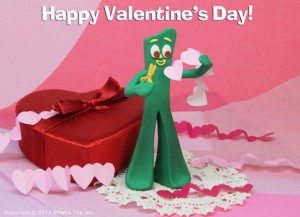 Gumby cutting paper hearts for Valentine's Day