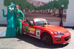 Kenton Koch with Gumby and his Gumby Fest race car, suit and helmet.